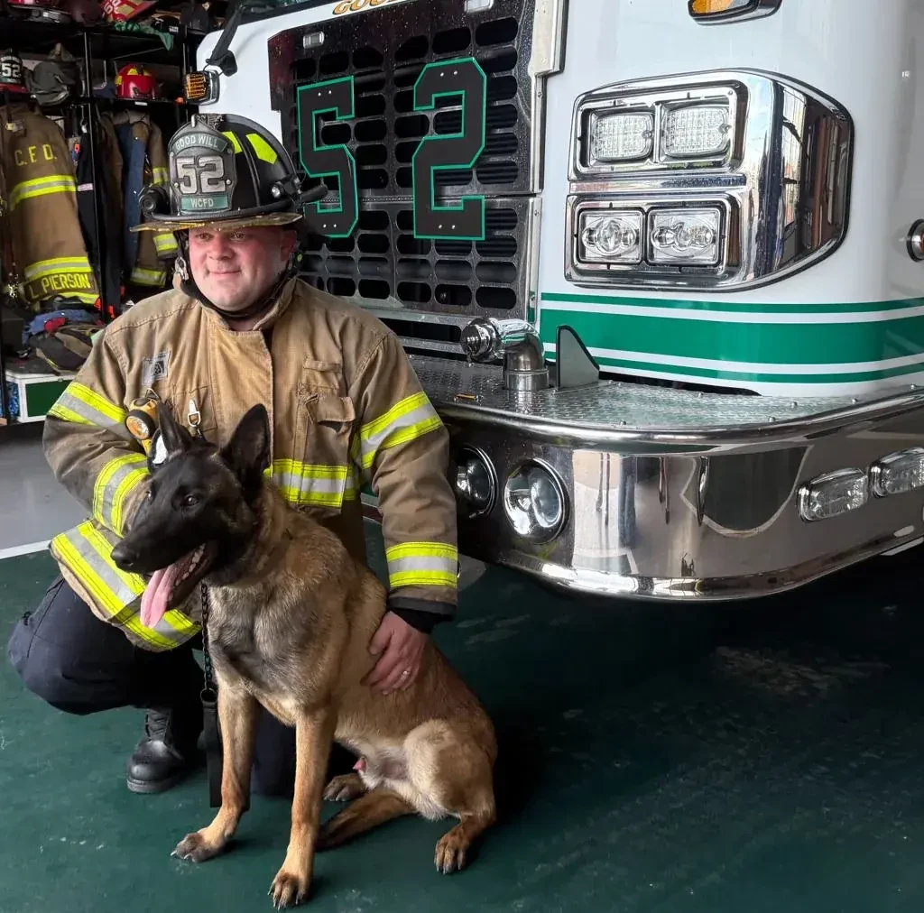 Joe Majuri, owner of ClearFlow Gutter Cleaning, with his K9 partner Chaos at the West Chester firehouse
