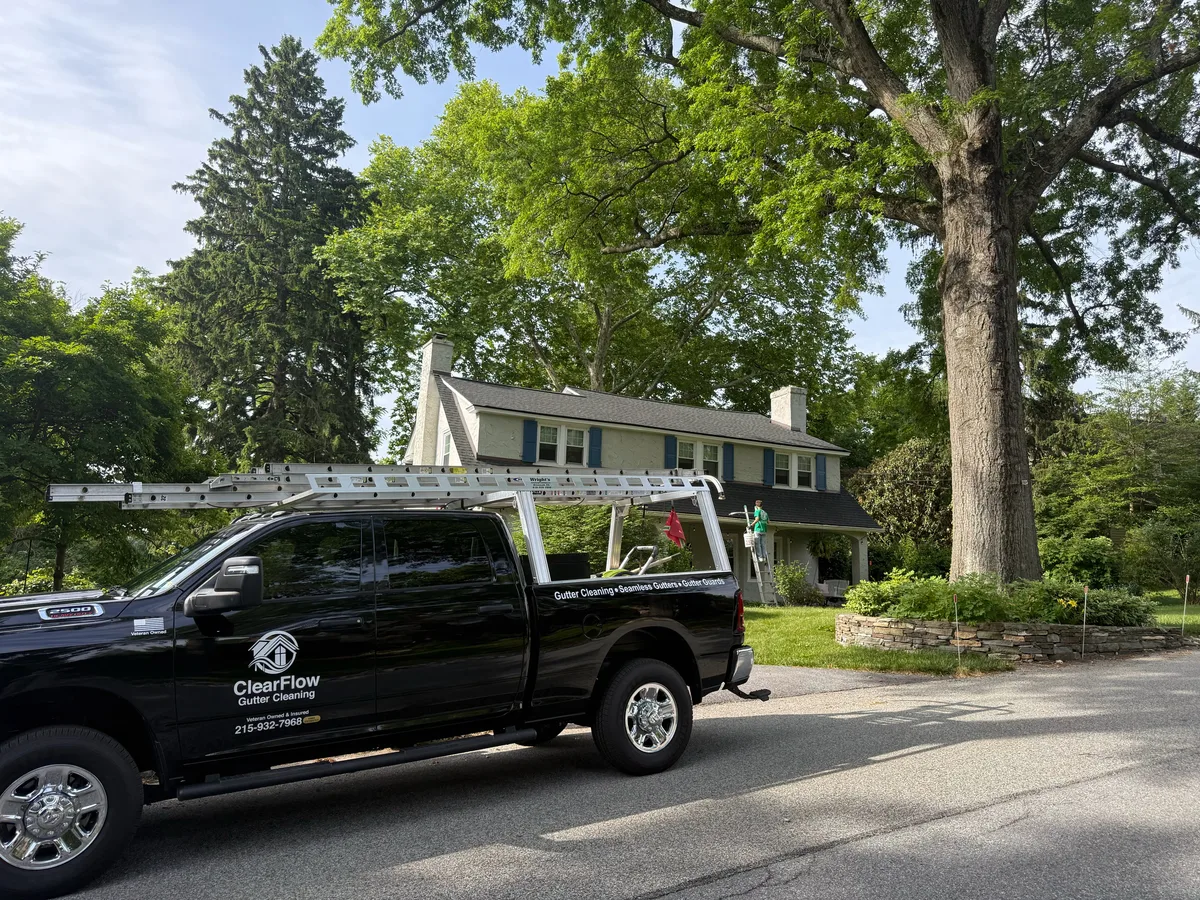 ClearFlow Gutter Cleaning truck on a residential job site