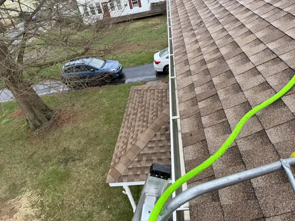 Gutter cleaning in Newtown Square PA before and after pine needle removal, after