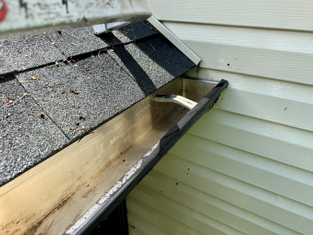 Gutter cleaning in Northern New Castle County DE before and after tree sapling and pine needle removal, after