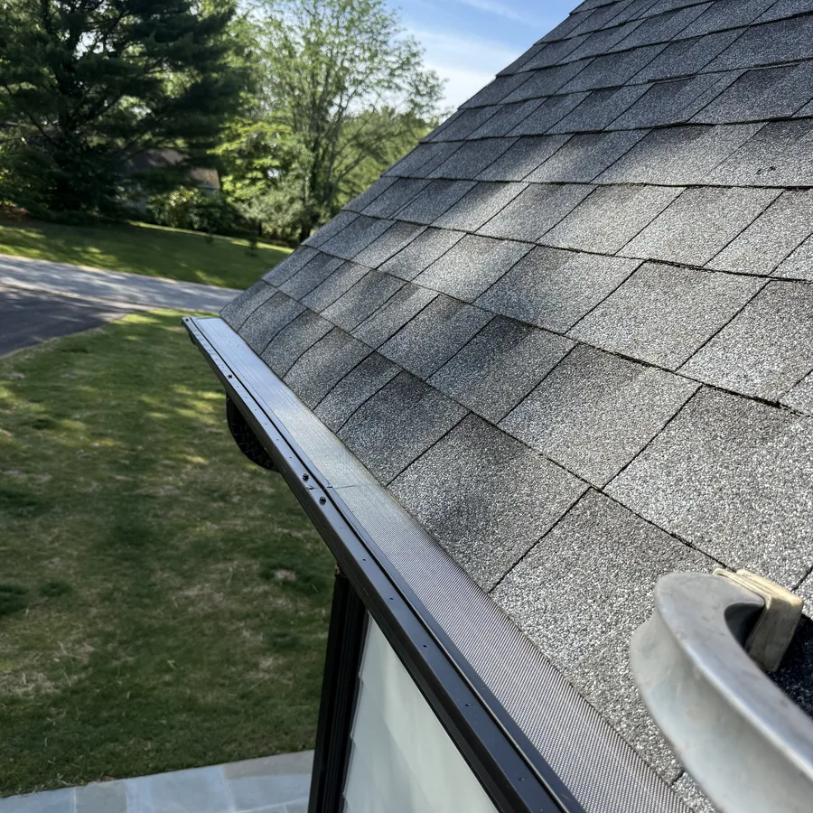 Gutter guard installed on a home with dark fascia